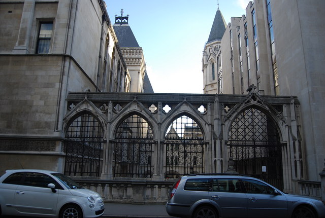 Stone arches of the Royal Courts of Justice in London, which houses the High Court of Justice of England and Wales.